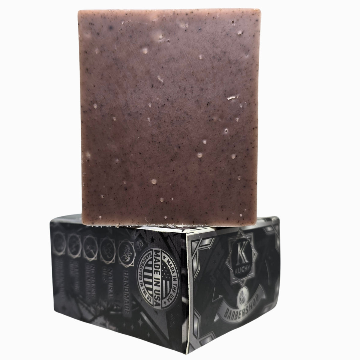 Close-up of Klichy Barbershop natural soap bar texture, medium grit exfoliant from rose clay